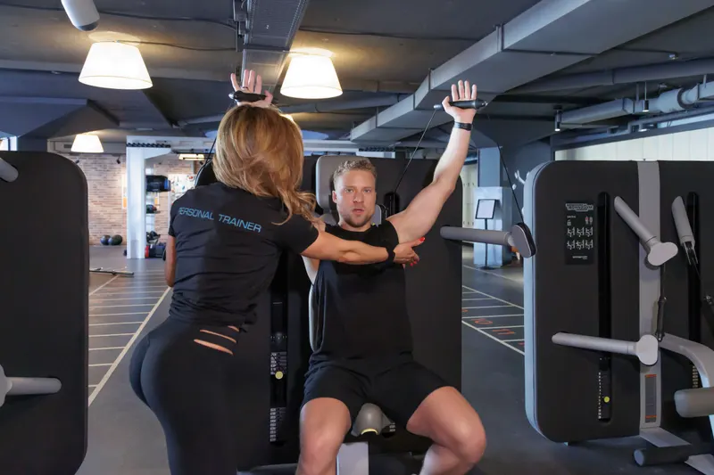 Nucia Freitas guiding a client through a one-on-one personal training session